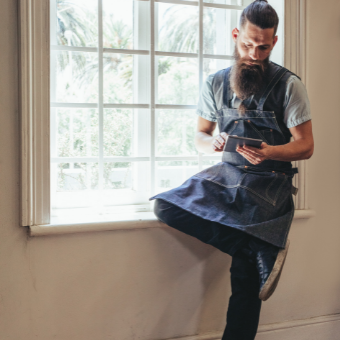 Barber looking at his ipad